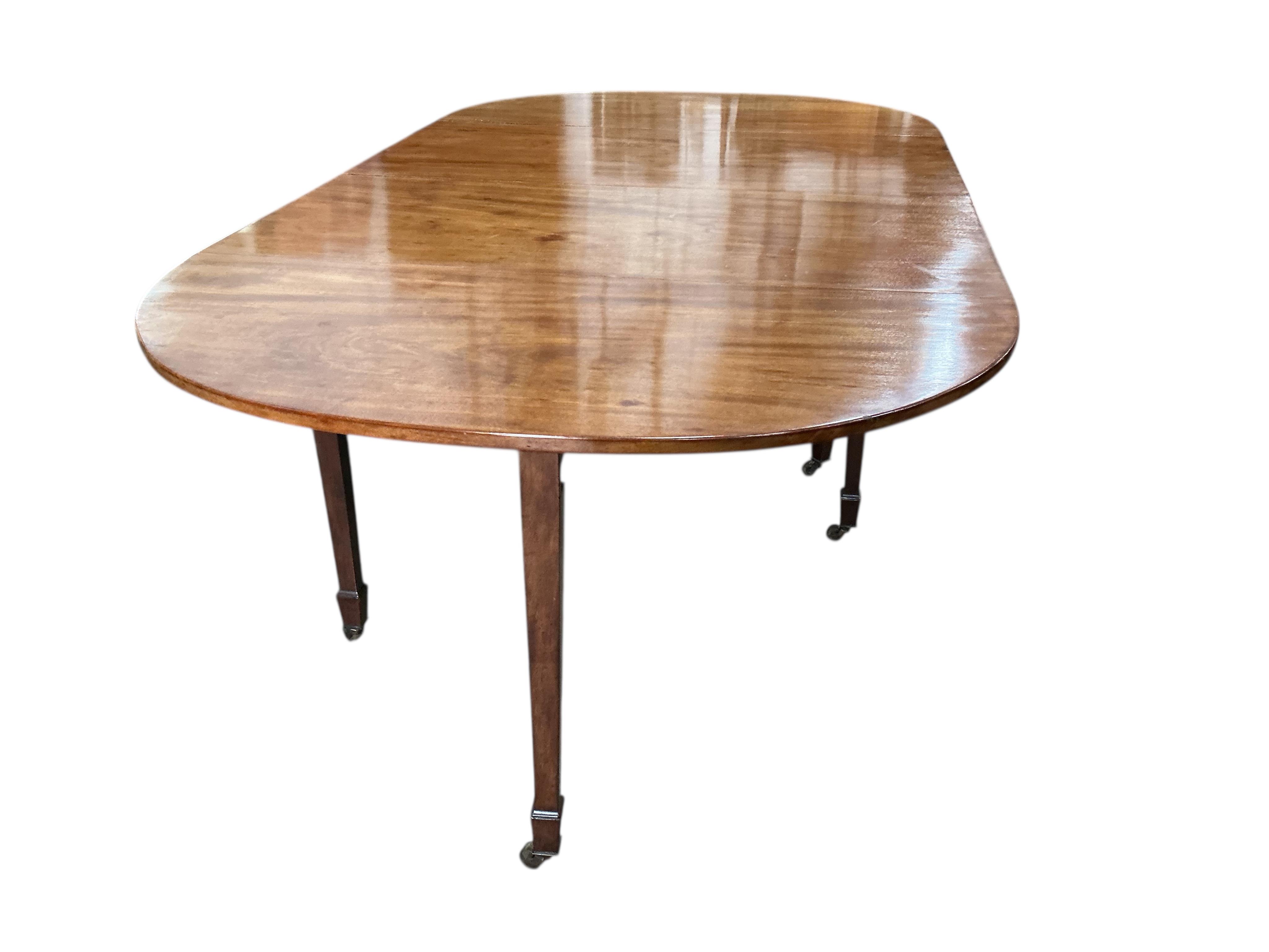 A George III and later mahogany D end extending dining table, width 217cm extended, one spare leaf, depth 122cm, height 76cm